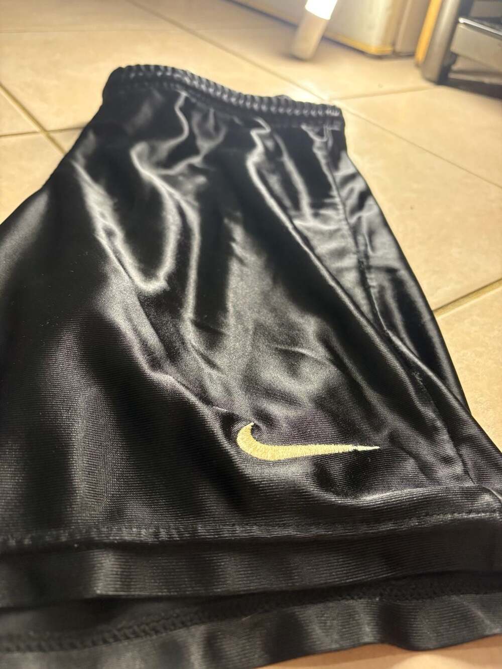 Vintage nike black athletic shorts with gold embroidered swoosh youth medium m 1